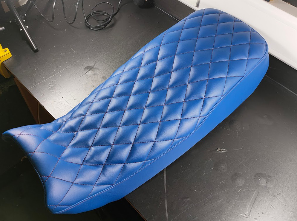 Blue scooped and quilted motorbike seat Boundary Car Care