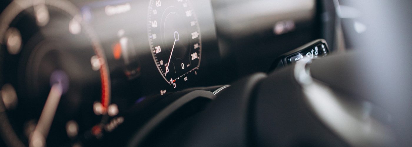 Car dashboard and wheel close up