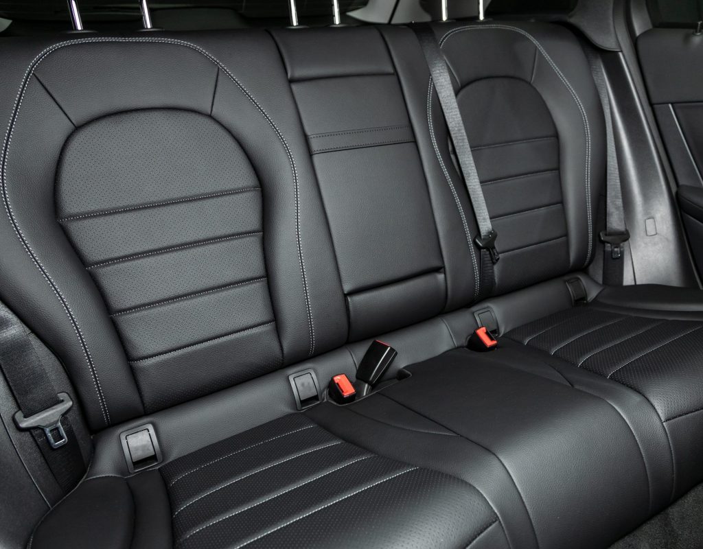 Leather interior design, car passenger and driver seats with seats belt.